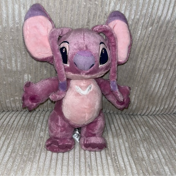 Disney Other - Disney Lilo & Stitch Pink Angel 10” Plush Stuffed Animal standing purple